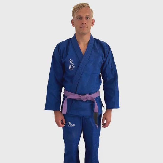 athelete walking in a blue brazillian jiu-jitsu gi